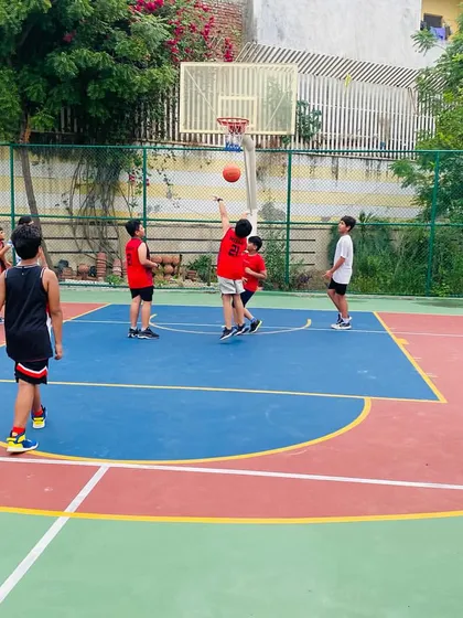A player takes a shot during a junior coaching session.