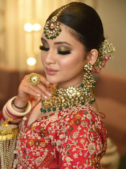 Another detailed shot of the Kundan necklace, showing the beautiful interplay of pearls and green beads that add a touch of colour and elegance.