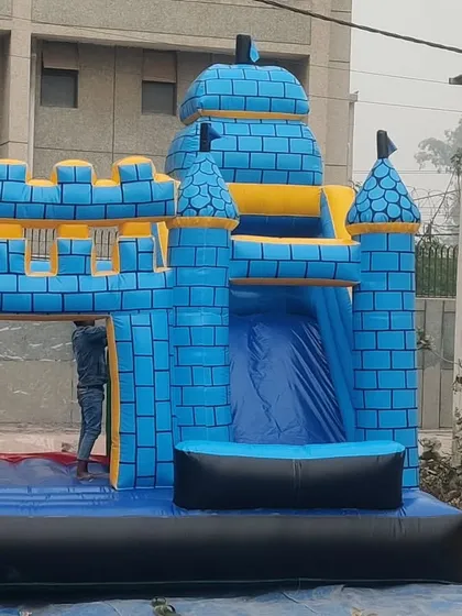 A classic blue inflatable castle with a jumping area and an internal slide. This simple, timeless design is always a popular choice.