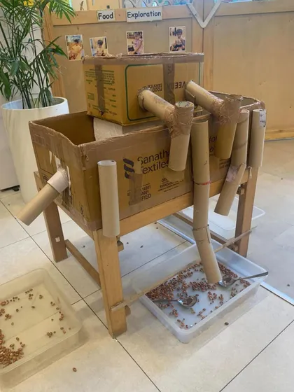 This homemade marble run, constructed from cardboard boxes and tubes, is a perfect example of a Reggio-inspired provocation. It invites children to explore gravity, momentum, and cause and effect using recycled materials.
