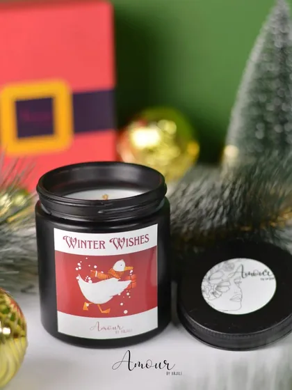 The 'Winter Wishes' jar candle has a lovely apple and clove scent, perfect for those who love warm, spicy fragrances during the holidays.