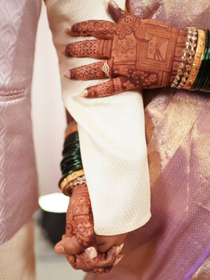 A close-up of the couple's hands after the engagement, a simple yet powerful symbol of their union.