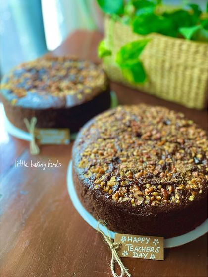 A close-up of the "Happy Teacher's Day" tag on one of the chocolate date and walnut cakes.