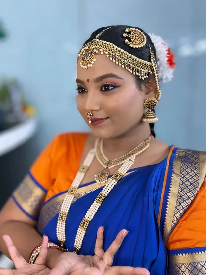 Another detailed shot of the dancer's makeup and traditional head jewellery.