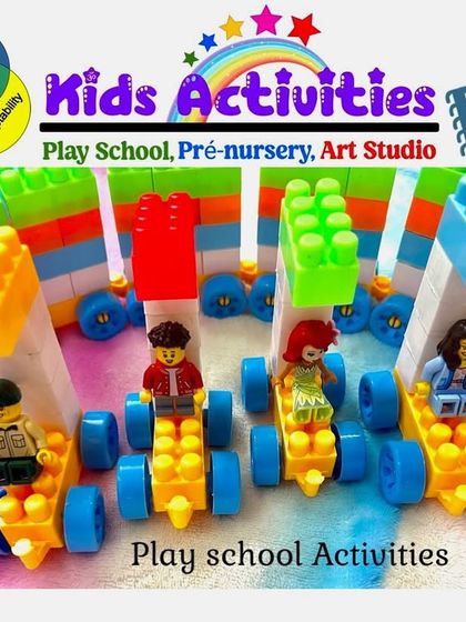Building with blocks is a classic and effective play school activity. These children have created a line of block cars with figures, an exercise that develops cognitive flexibility, awareness, and adaptability through fun and play.