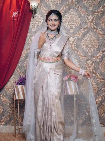 A full-length view of the elegant silver saree look.