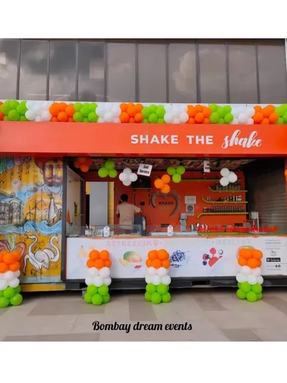 I provide patriotic decor for businesses of all sizes. This balloon arrangement for 'Shake the Shake' features a full arch and pillars in the colors of the Indian flag, perfect for celebrating Republic Day or Independence Day.