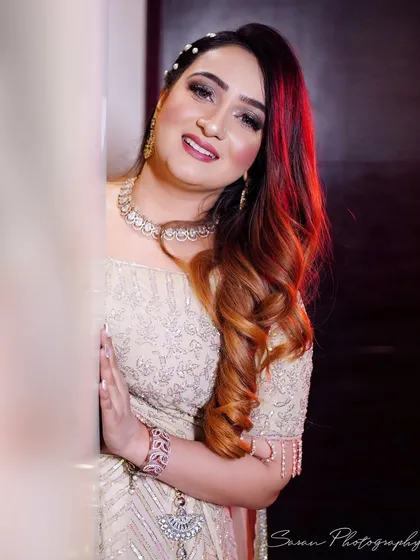 A beautiful portrait of the bride-to-be at her engagement, smiling warmly at the camera.