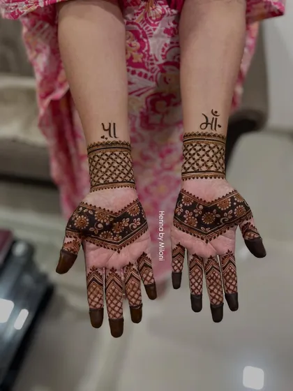 A heartfelt tribute to parents. This client wanted to honor her 'Maa' and 'Paa' with their names written in beautiful Devanagari script on her wrists.
