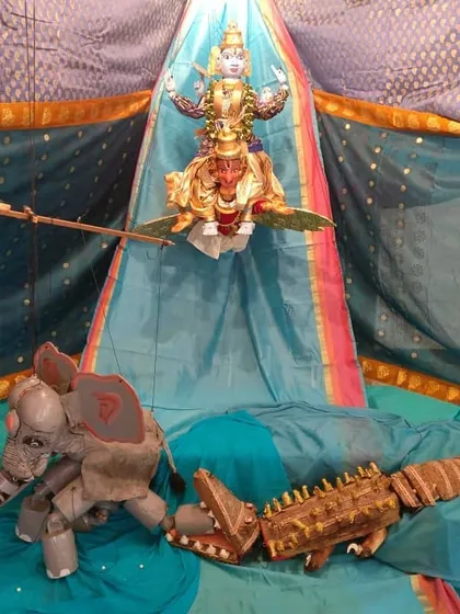 A scene from the Gajendra Moksha story, depicted with our handcrafted puppets. This display showcases the intricate detail and expressive artistry that goes into each character, from the divine form of Vishnu to the elephant and crocodile.