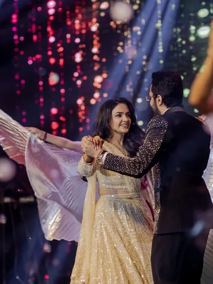 A beautiful shot of the couple's dance, using props like Isis wings to add a dramatic and visually stunning element.
