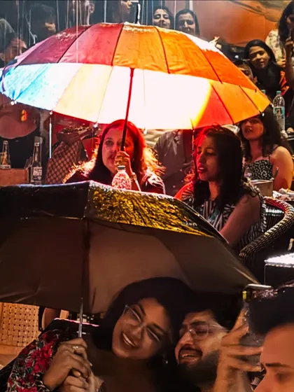Not even a little rain can stop our vibe. The umbrellas came out and the singing continued with even more josh.