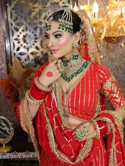 A side profile showing the beautiful drape of the dupatta and the details of the matha patti.