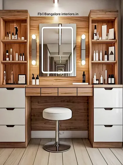 A well-designed vanity is essential. We created this custom dressing table with ample storage, including deep drawers and open shelving, complemented by vertical sidelights and a backlit mirror to provide perfect, even lighting for your daily routine.