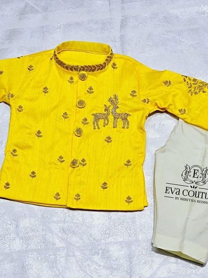 A different angle of the yellow kurta set with deer embroidery.