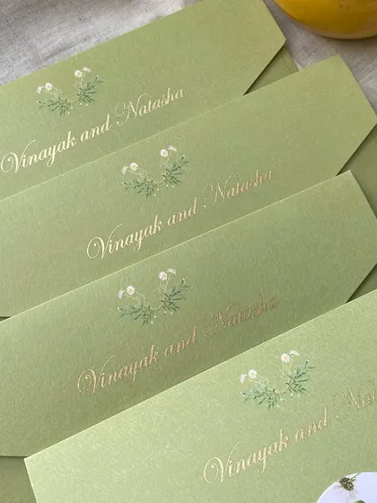 For this cross-cultural wedding in the UK, I designed these elegant sage green envelopes with the couple's names in gold foil. The design inside was a beautiful fusion of Indian and British elements.
