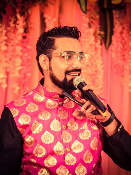 Here I am, sharing a story and a laugh with the guests. My approach is conversational and friendly, making everyone feel comfortable and ready to participate in the festivities.