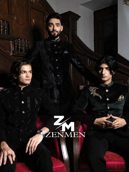 A group shot of three models in different velvet bandhgalas, showcasing the variety of styles from classic black to emerald green.