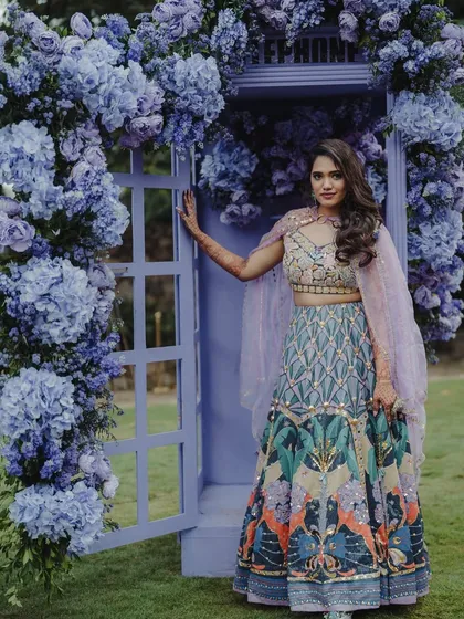 Let's create whimsical, Instagram-worthy moments for your guests with custom-built photo booths, like this enchanting purple telephone booth covered in hydrangeas.