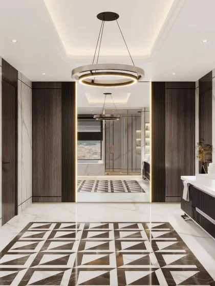 A perspective view of the grand bathroom, looking from the vanity area towards the rest of the suite. This shot gives a sense of the space's depth and luxurious scale.
