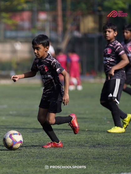 A player dribbles forward with speed and focus during a competitive match.
