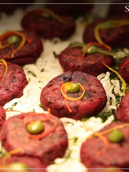 Close-up of vibrant beetroot tikkis served at the Van Mahotsav event. Our farm-to-table menu celebrated sustainability and mindful eating.