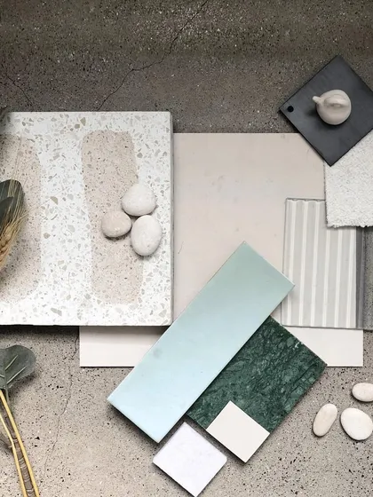 Our design process begins with a deep exploration of materials. This palette for our 'Crème' project shows how we layer textures and tones, combining terrazzo, stone, glass, and textiles to build a cohesive and sensory narrative long before construction begins.