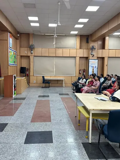 A wider angle of the workshop hall, showing the attentive audience of teachers eager to learn about improving their health and well being.