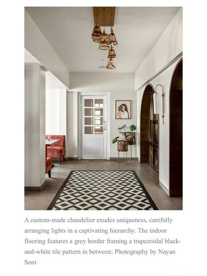 A full-page view from the magazine feature, detailing the custom chandelier and the striking geometric flooring I chose to complement the restaurant's art deco theme.