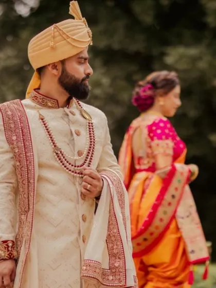 A beautiful shot of the bride and groom. Her elegant updo is the perfect complement to her traditional wedding attire.