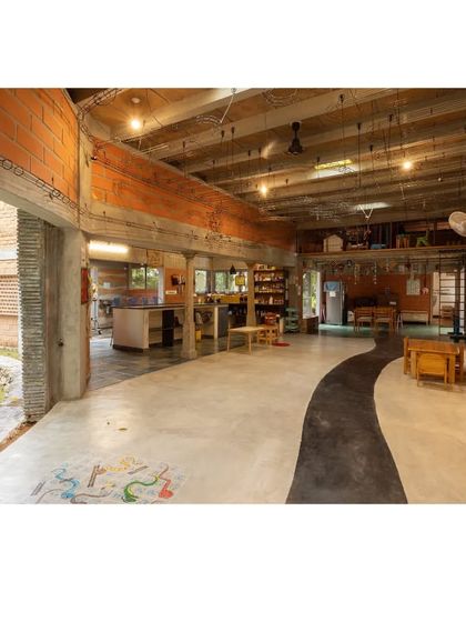 I design corridors that are more than just passages; they are extensions of the learning space. This open hall at the Foothill Learning Centre flows directly into a garden, with a curved path on the floor guiding movement and inspiring play.
