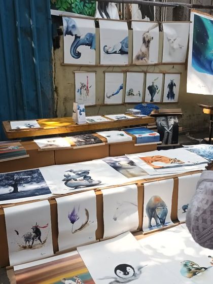 A display of beautiful watercolour prints and original art at the Chithrasanthe, featuring animal and nature themes.
