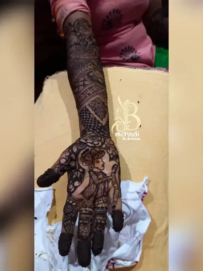 A close-up of the groom's portrait on the palm, designed to mirror the bride's portrait on the other hand.