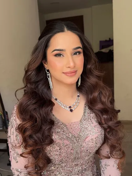 A beautiful portrait showcasing the soft glam makeup. The look is radiant and polished, perfect for a sangeet celebration.