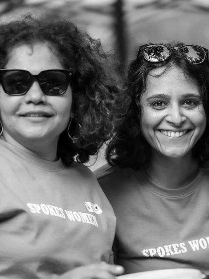 Smiles all around. Two of our members enjoying the Garage Sale in their matching pink 'Spokes Women' T-shirts.