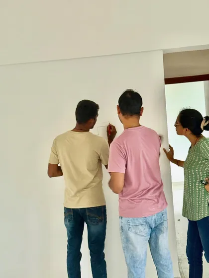 Sketching out ideas on the wall with clients. This is the very first step where a blank wall starts its journey to becoming a feature wall.