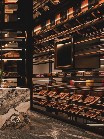 A visualization of a high-end cigar lounge or wine cellar, with meticulously organized shelves and dramatic lighting.