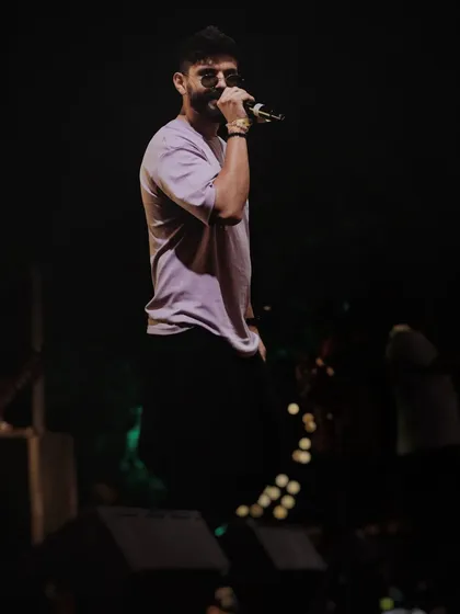 A candid shot from the stage at Horn OK Please. This is me in my element, feeding off the crowd's energy and giving it right back.