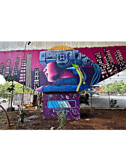 Another bridge mural from the same public art series. This piece explores the theme of future technology with a cyberpunk-inspired portrait and cityscape.