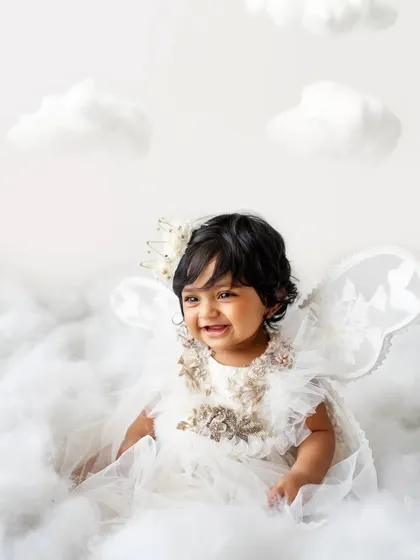 Another beautiful smile from this heavenly session. The light and airy feel of this setup is just perfect for baby portraits.