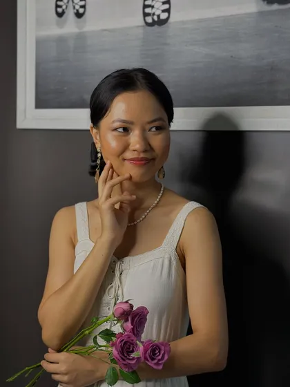 This portrait captures the delicate and timeless quality of the soft makeup look, a versatile skill for any makeup artist.