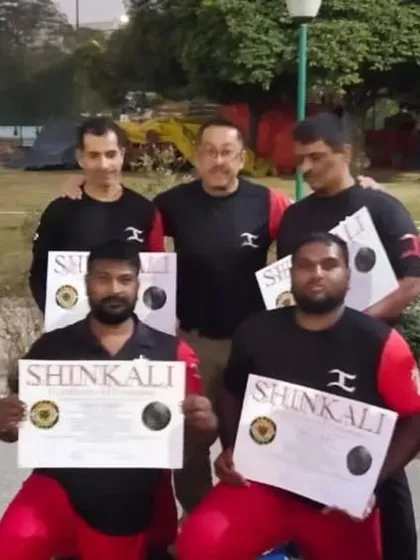 The whole team receiving their SHINKALI promotions from Sensei E. We took full advantage of his time with us to deepen our understanding of the art.