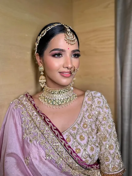 A close-up of Mahek's phera makeup, featuring a beautiful pink eyeshadow look and flawless skin that radiates health and happiness.