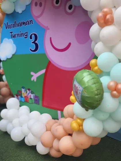 A close-up of the Peppa Pig backdrop, showing the vibrant colors and fun details that bring the theme to life.