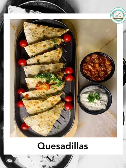 My vegetable quesadillas are loaded with fresh veggies and lots of cheese, served with salsa and sour cream. They make a great appetizer or a light main course.