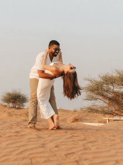 A spontaneous dip and a shared laugh in the middle of the desert. These are the candid, action-filled shots that bring a couple's fun-loving personality to life.