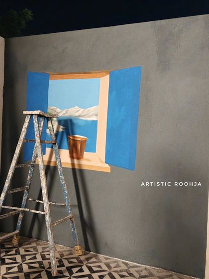 The mural in its early stages, with the basic shapes and colors blocked in, showing the transformation from a simple painting to a 3D illusion.