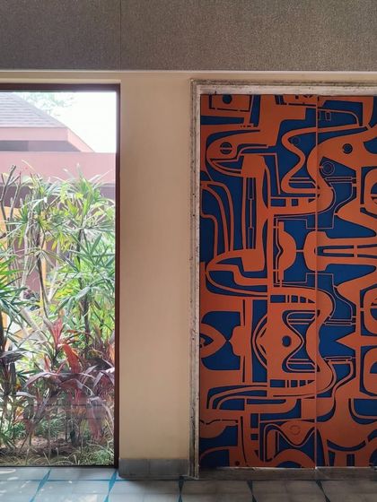 A straight-on shot of the door installed within the home's frame, highlighting its precise fit and its role as a functional architectural element that completely transforms the character of the space.