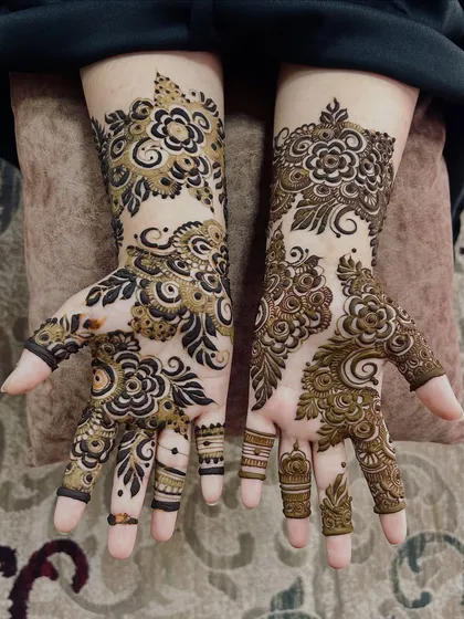 A beautiful floral design with a mix of bold, filled-in leaves and delicate flower outlines.