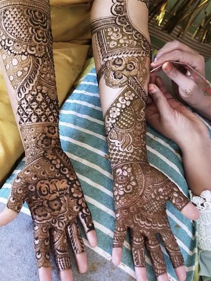 A special request to include the name 'Salman' in beautiful Arabic calligraphy on the palm. I love integrating personal elements like this into my traditional designs.